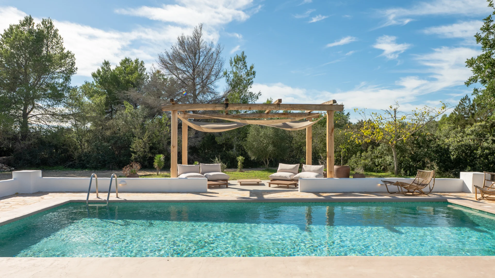 Pool with pergola and sun loungers at a finca in Santa Gertrudis, Ibiza