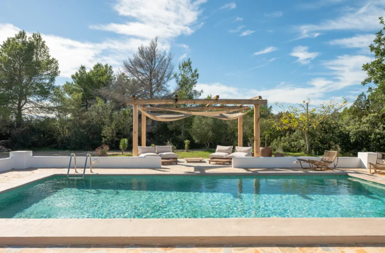 Pool with pergola and sun loungers at a finca in Santa Gertrudis, Ibiza