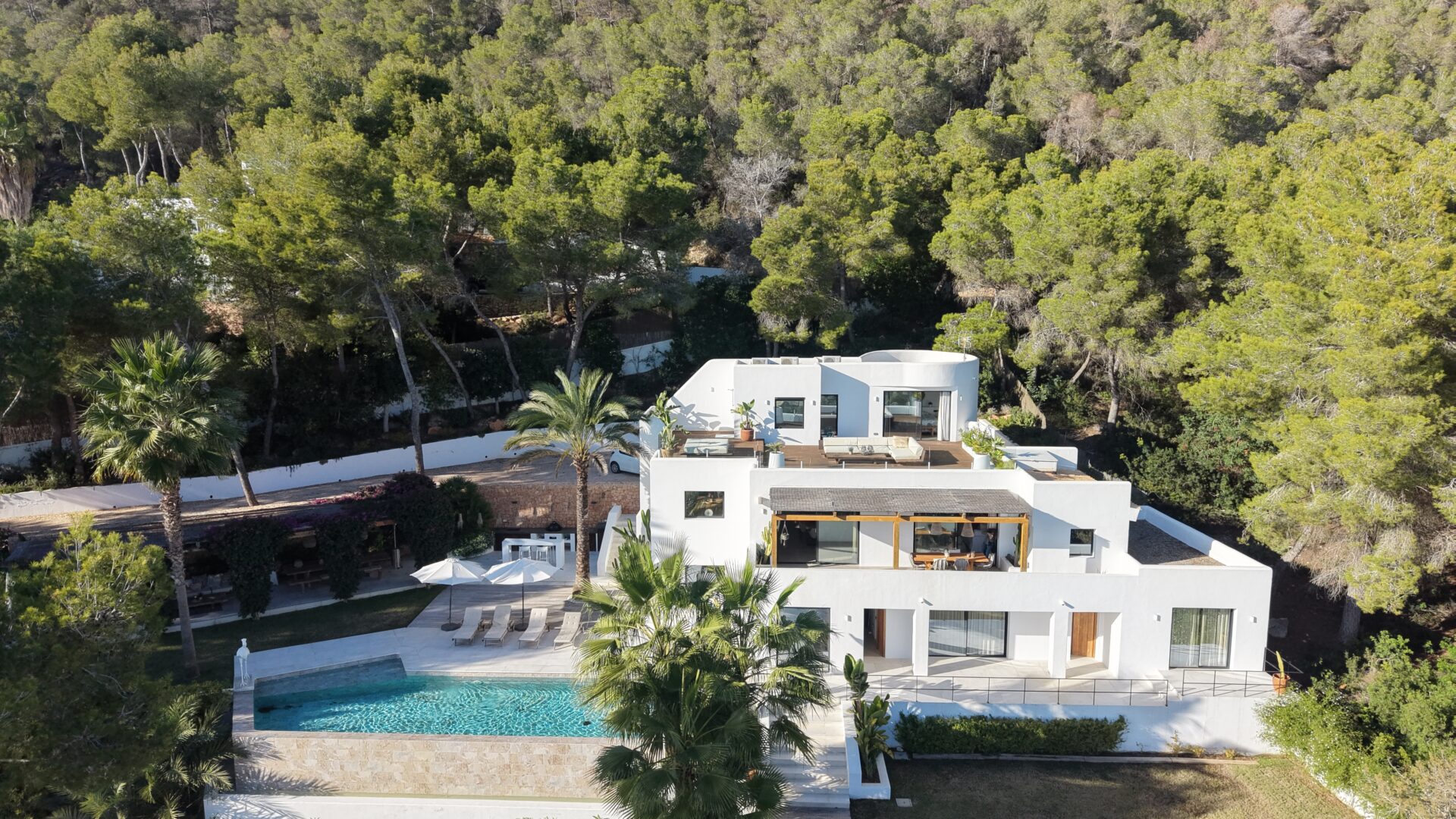 Aerial view of a sea-view villa, pool and terraces in Es Cubells, Ibiza