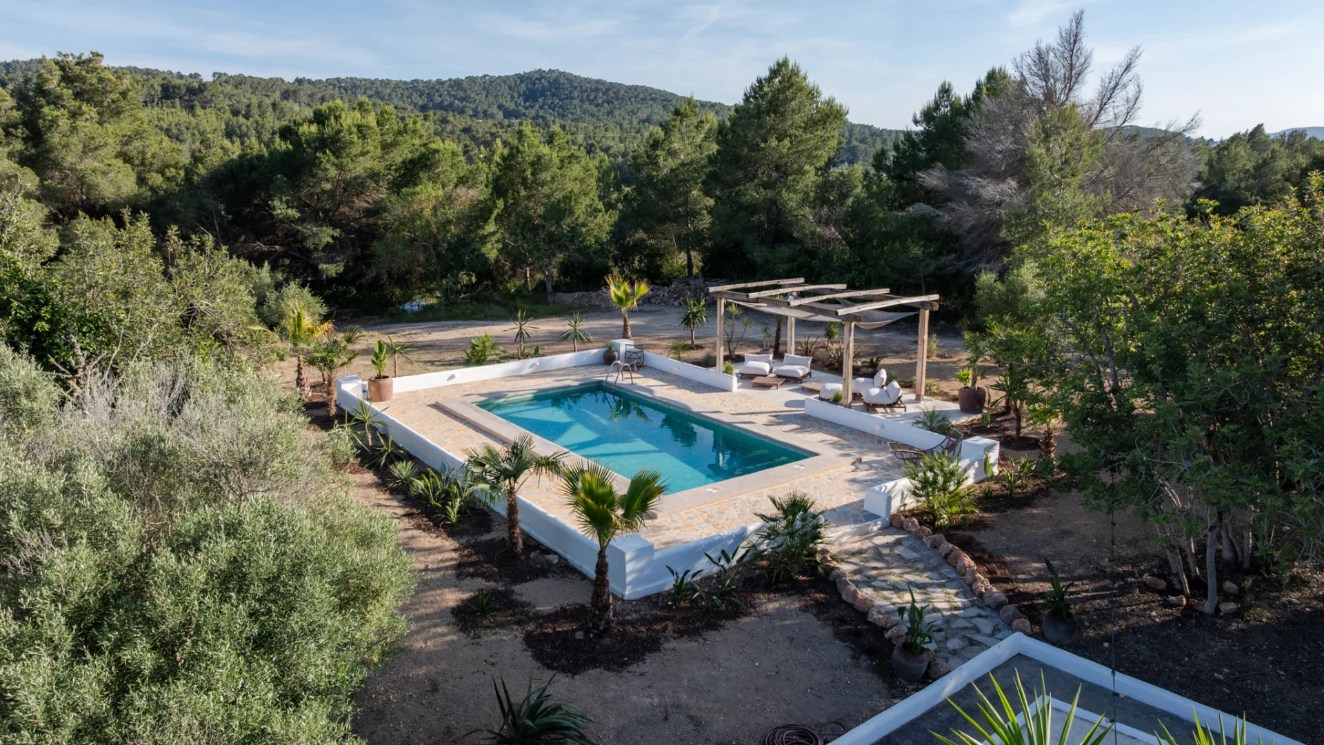 Aerial view of the pool and garden at a finca in Santa Gertrudis, Ibiza