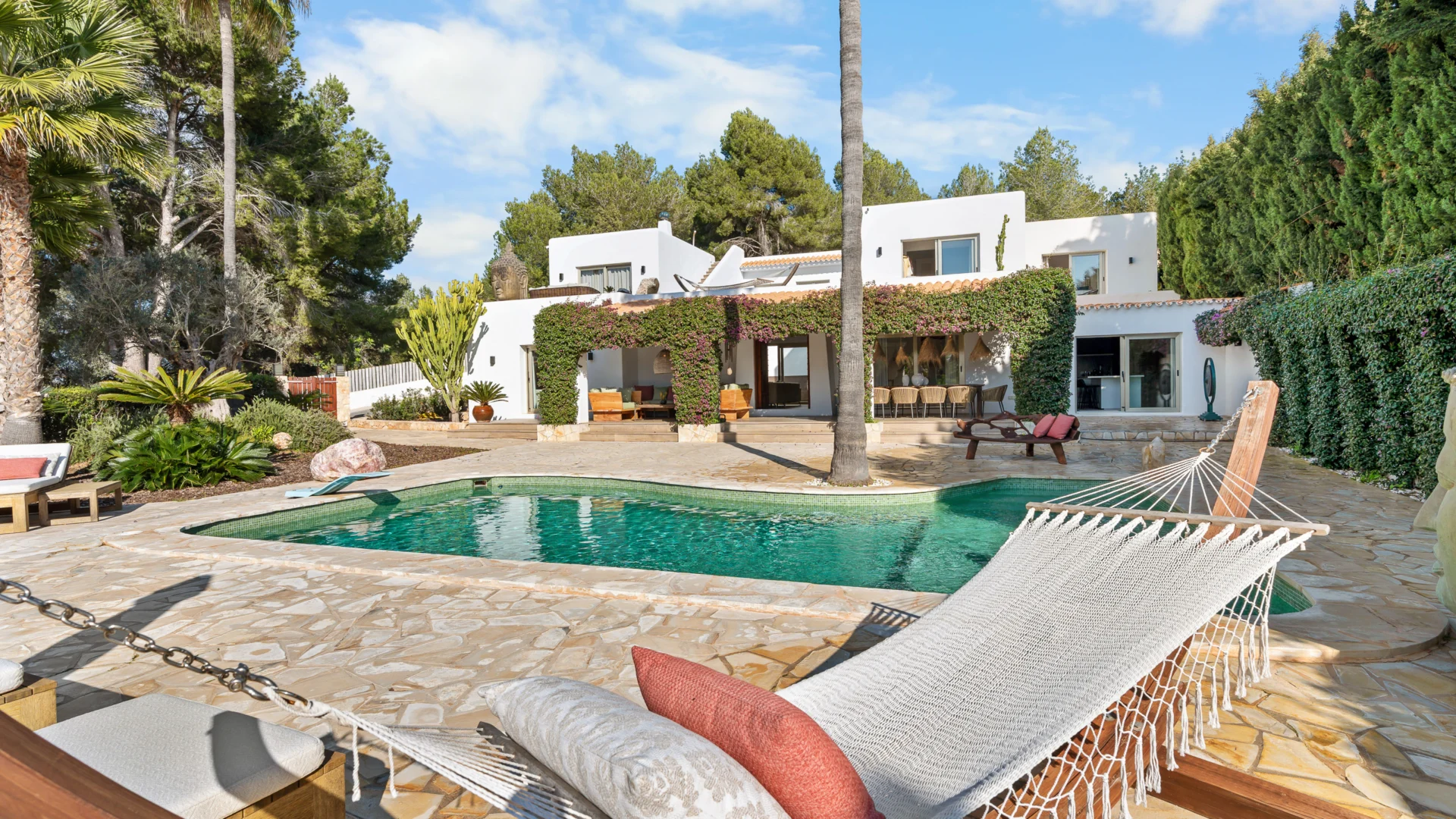 Pool with hammock and whitewashed finca in Jesús, Ibiza