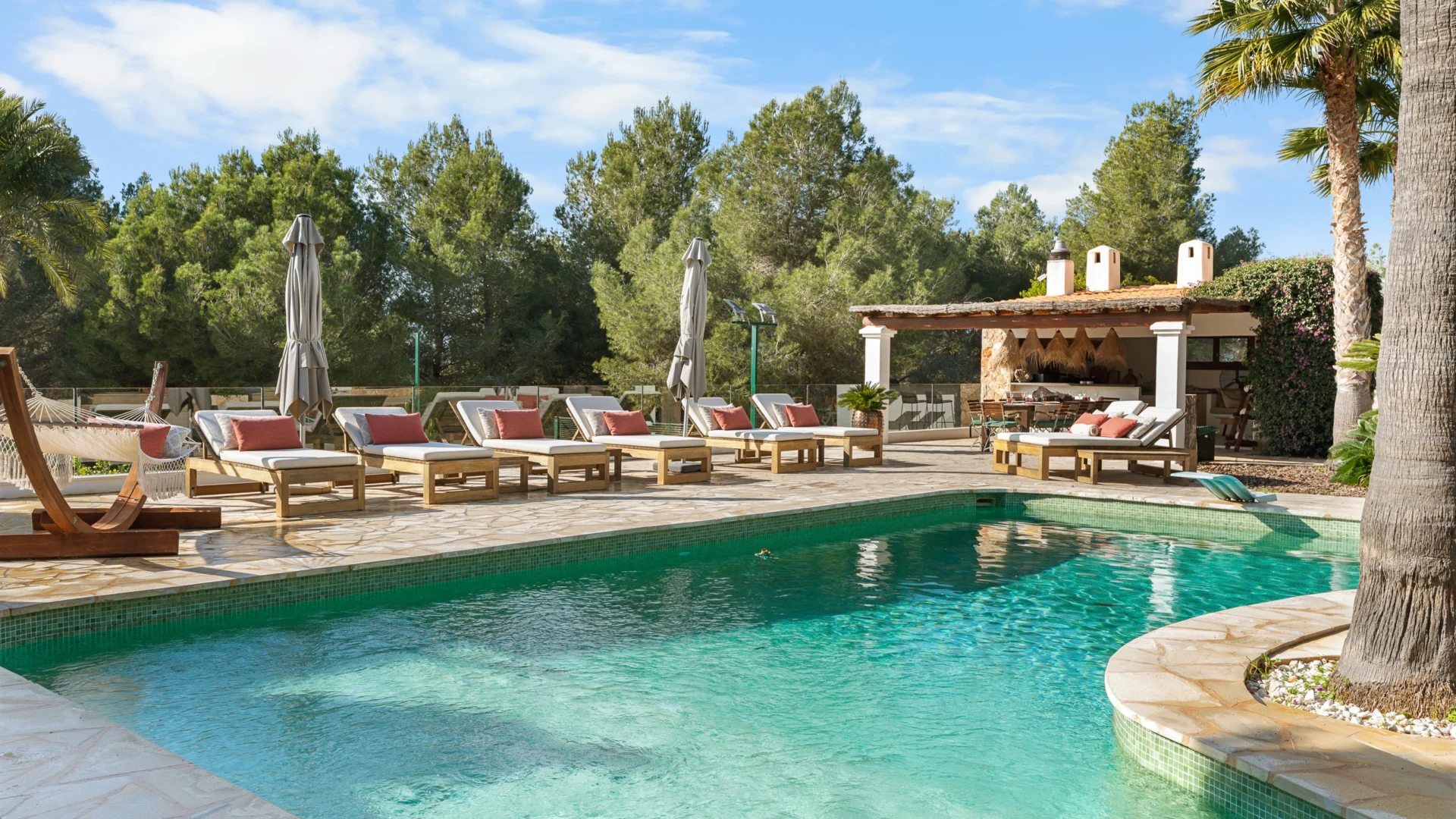 Pool with sun loungers and pergola at a finca in Jesús, Ibiza